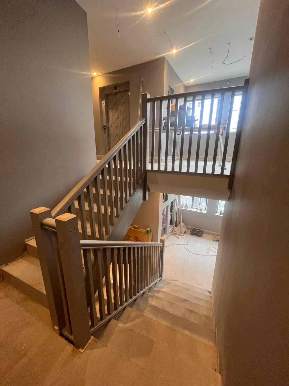 Staircase and landing with wood flooring