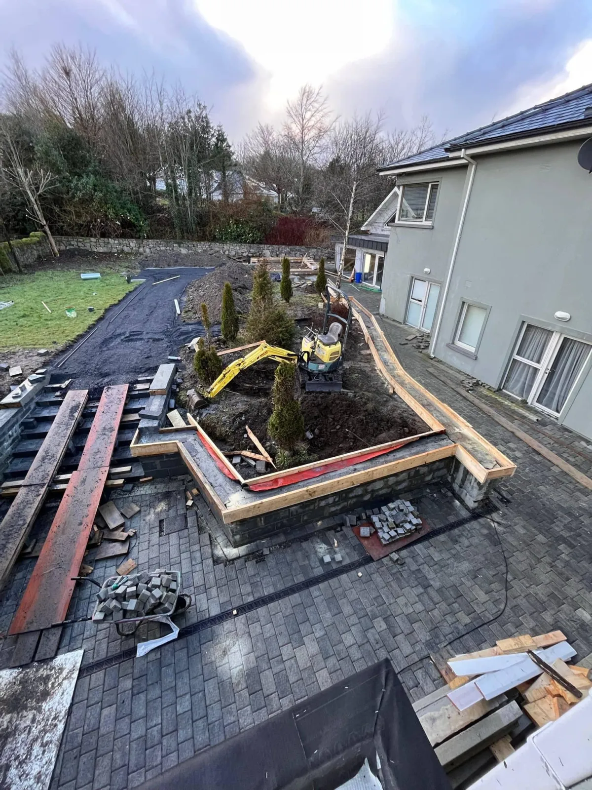 Site groundworks and driveway paving in progress