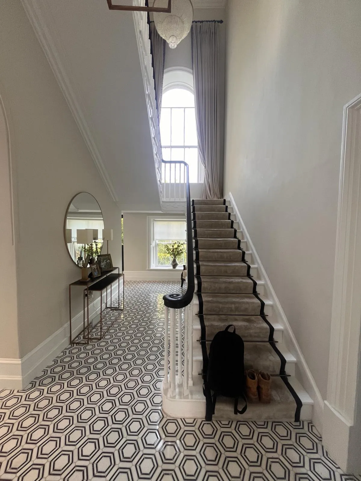 Period hallway restoration with patterned tile floor
